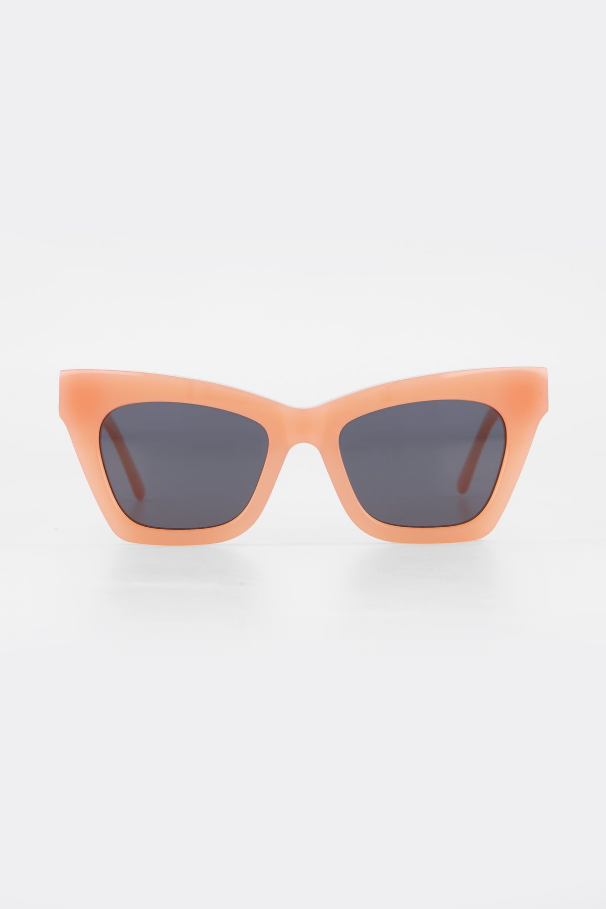 Isle of Eden Sienna blush sunglasses, front view showing angular cat-eye frame and grey lenses