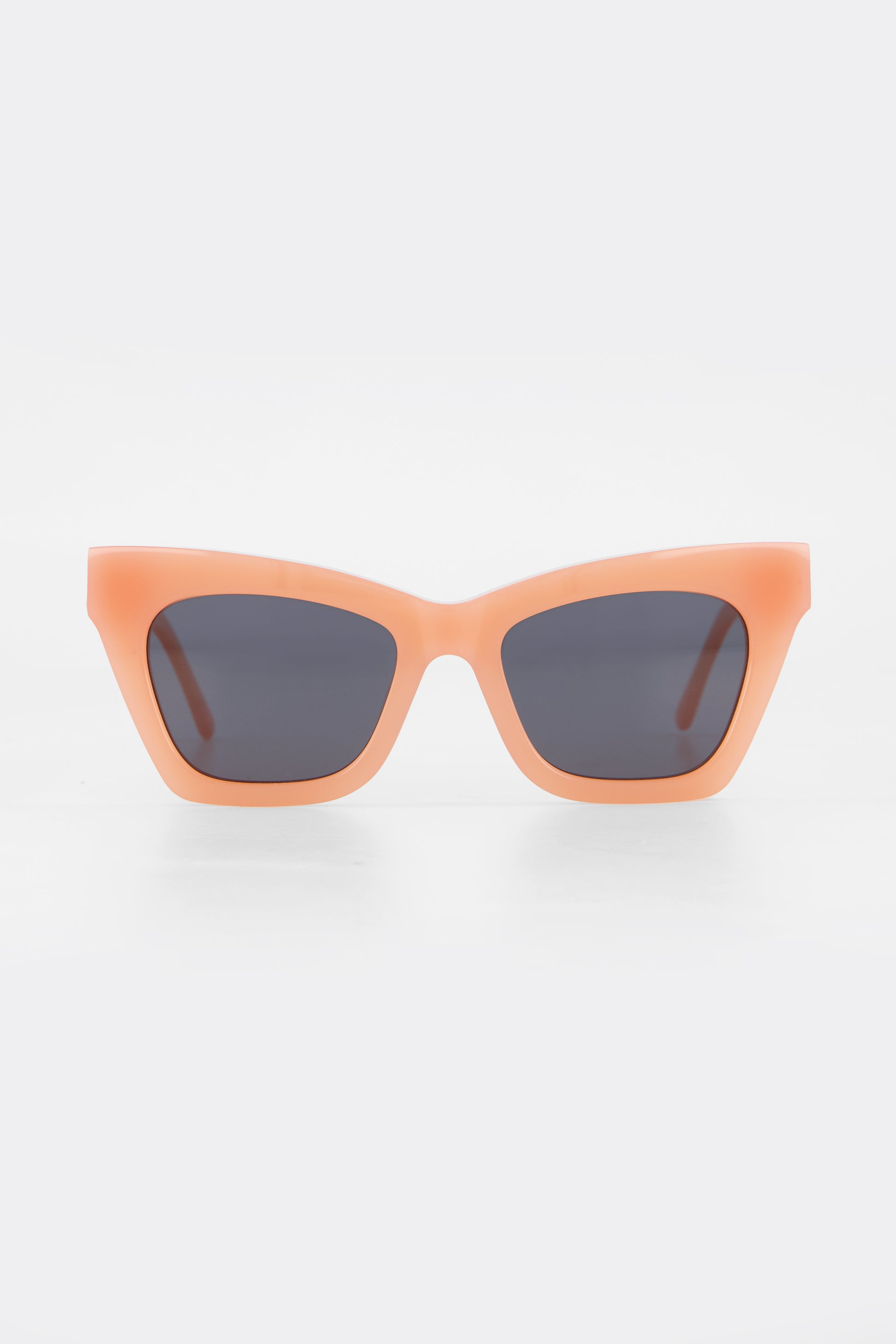 Isle of Eden Sienna blush sunglasses, front view showing angular cat-eye frame and grey lenses