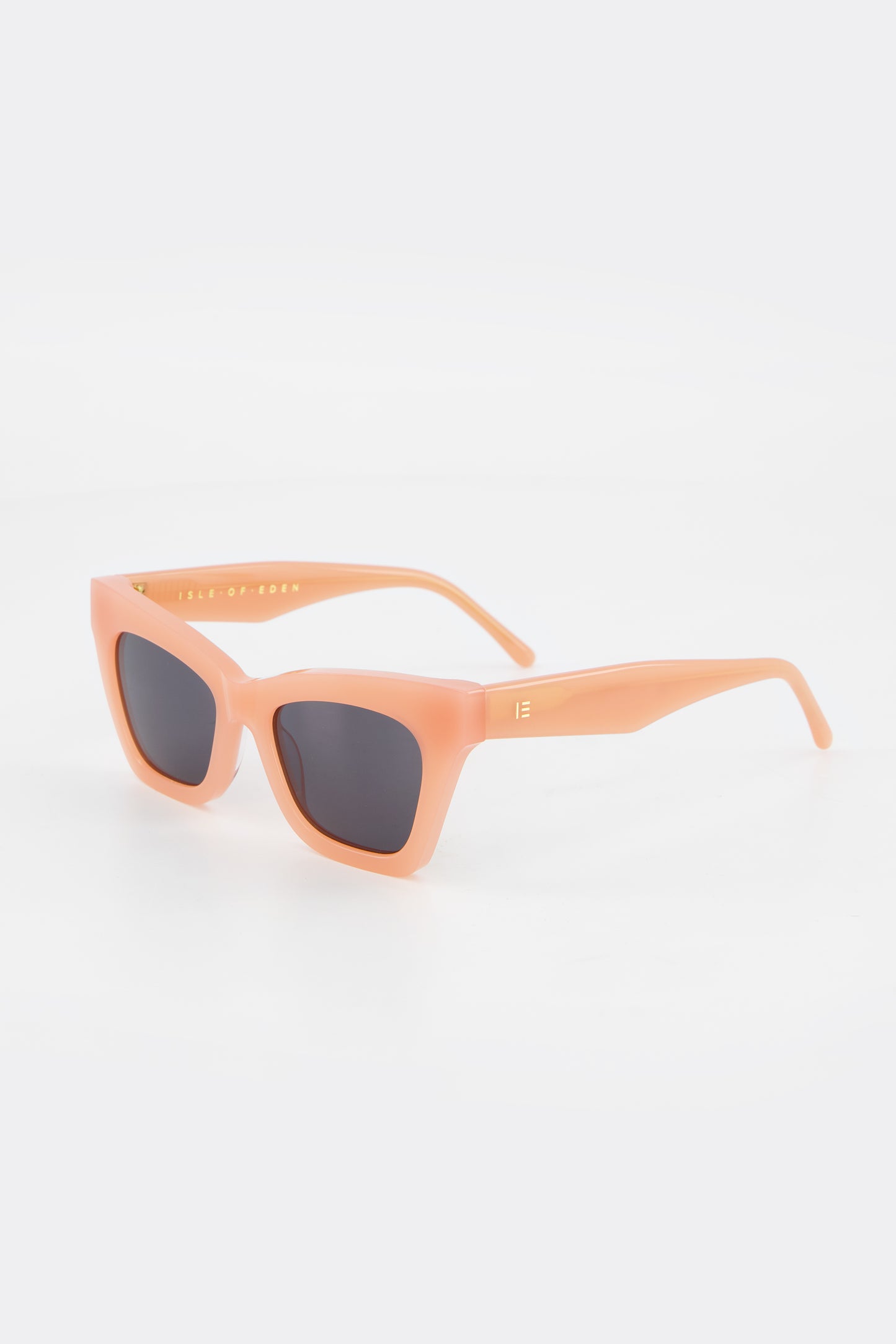 Isle of Eden Sienna blush sunglasses, three-quarter angle showing angular cat-eye frame
