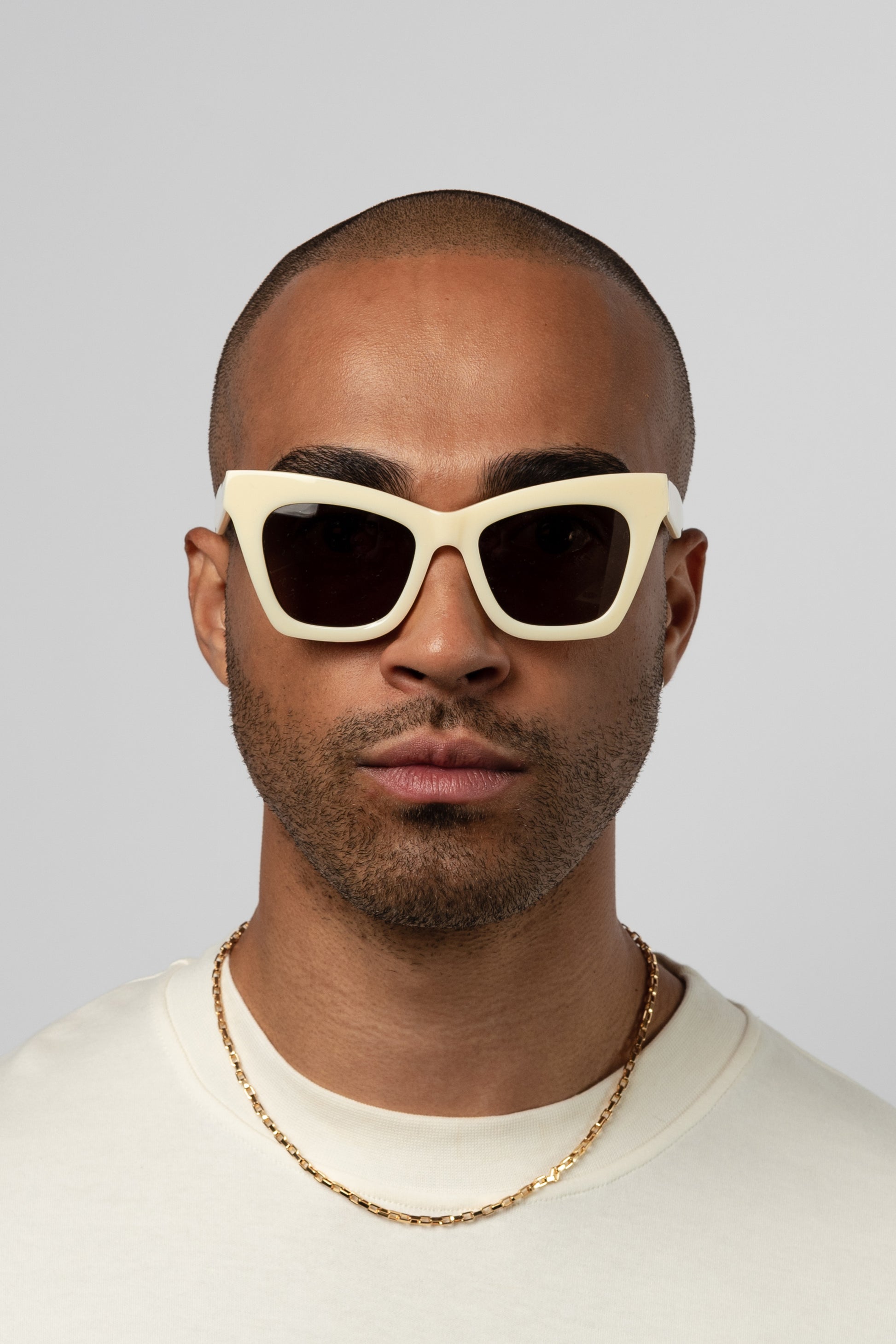Man wearing Isle of Eden Sienna ivory sunglasses, front-facing portrait