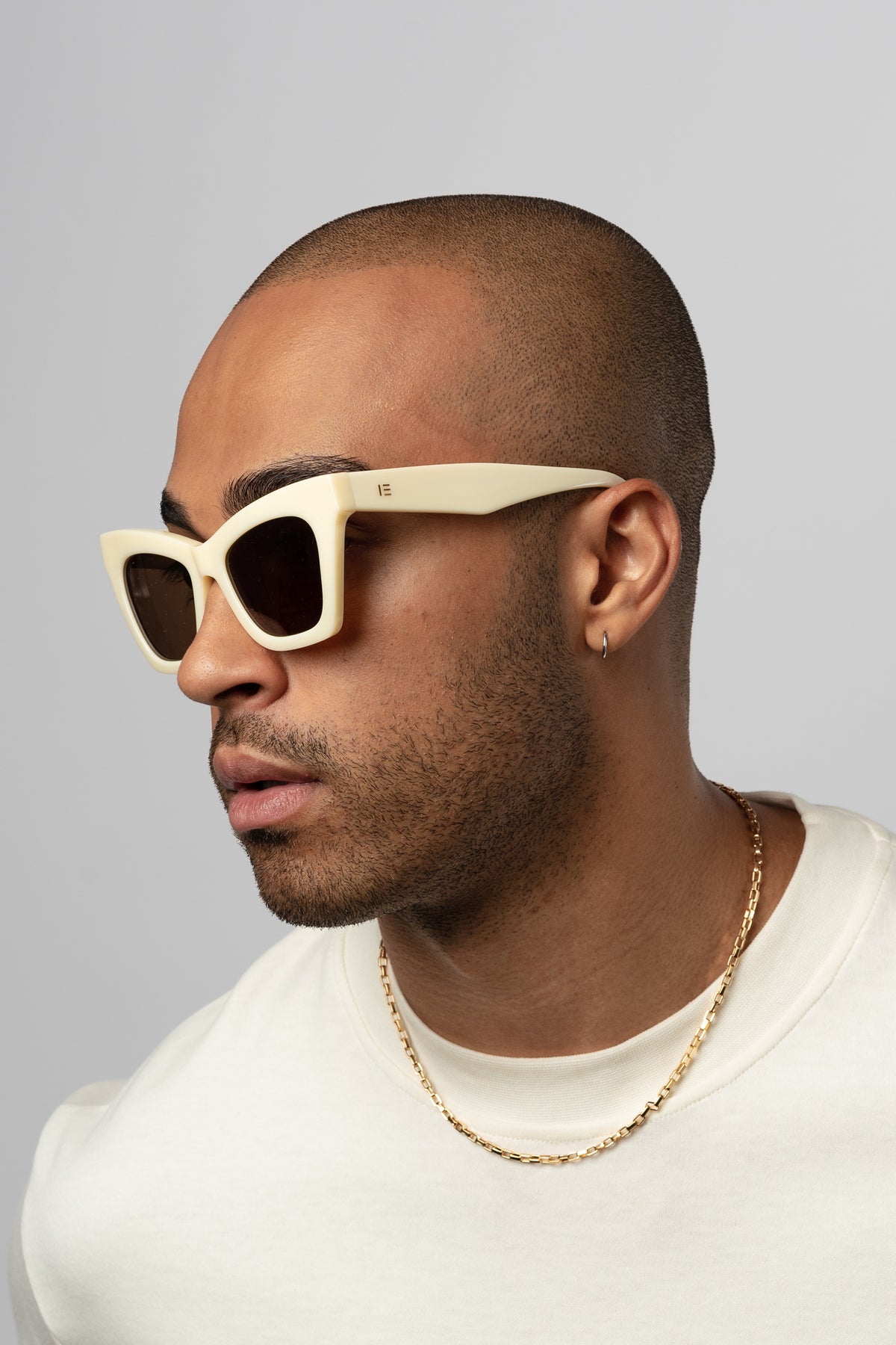 Man wearing Isle of Eden Sienna ivory sunglasses, side profile portrait