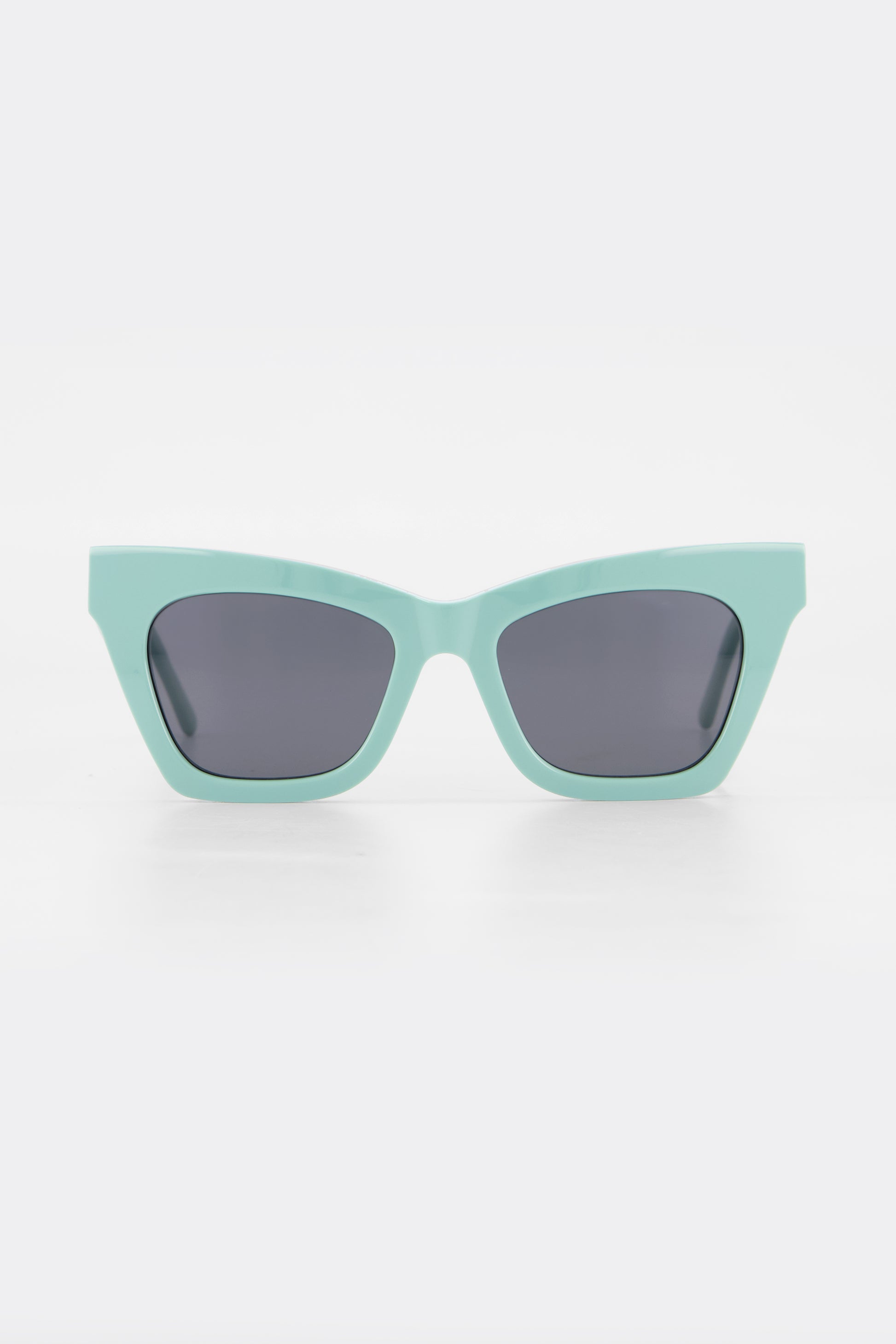 Isle of Eden Sienna mint sunglasses, front view showing angular cat-eye frame and grey lenses