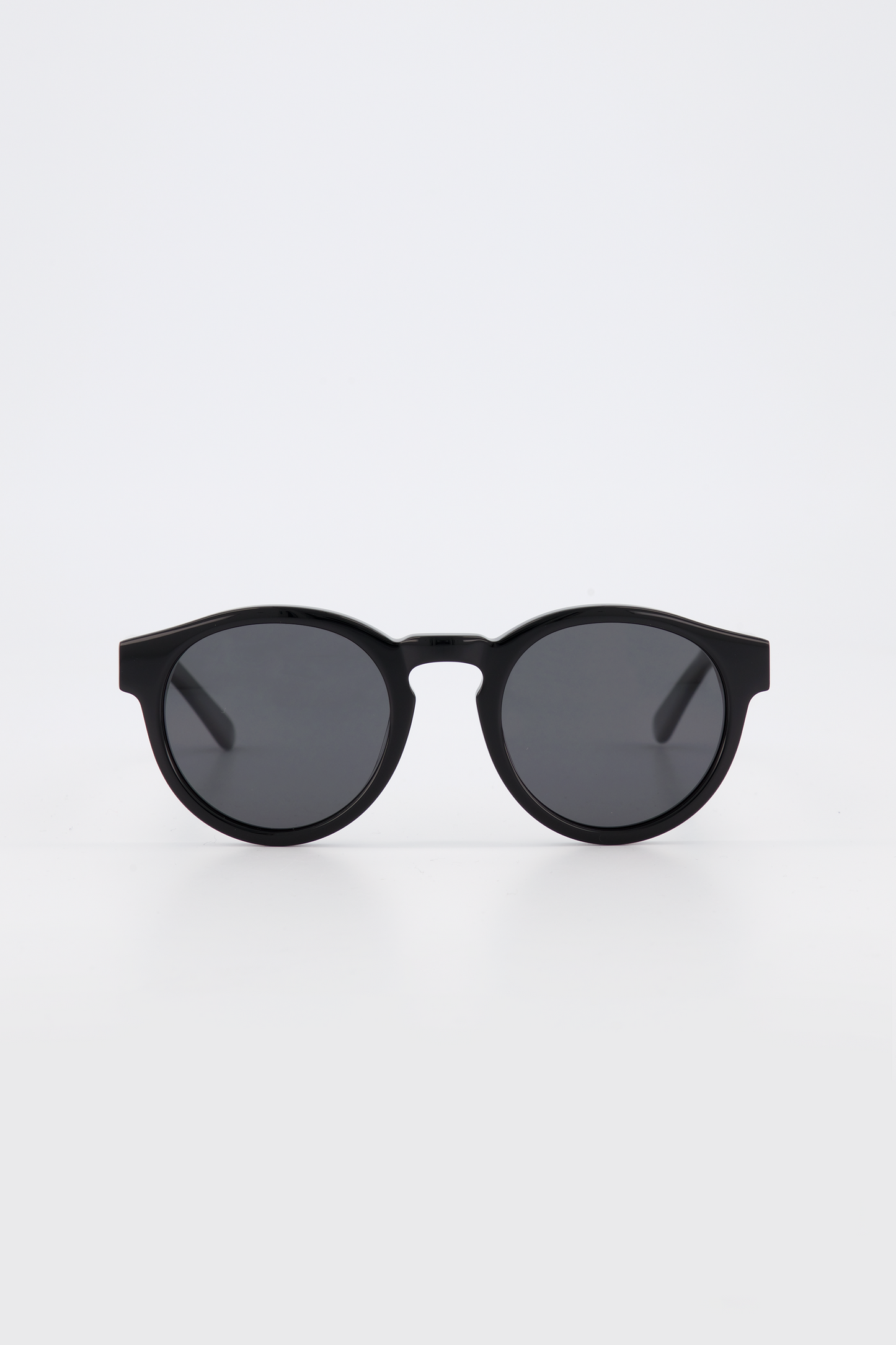 Isle of Eden Eddie black sunglasses, front view showing round frame and dark lenses