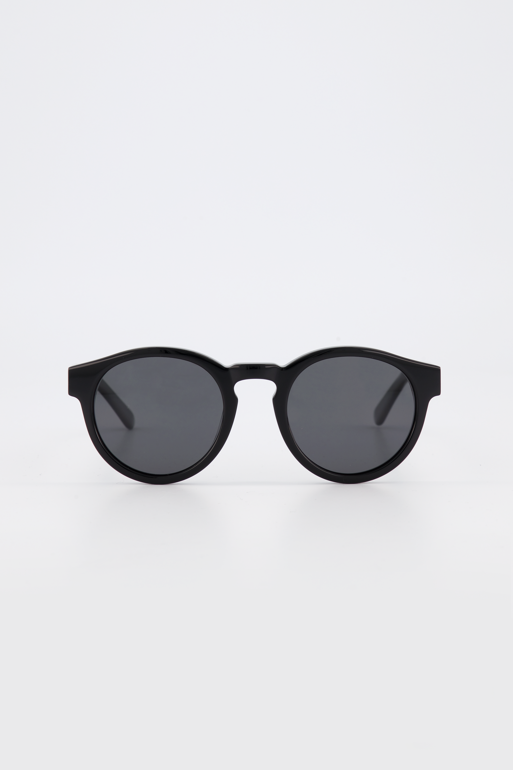 Isle of Eden Eddie black sunglasses, front view showing round frame and dark lenses