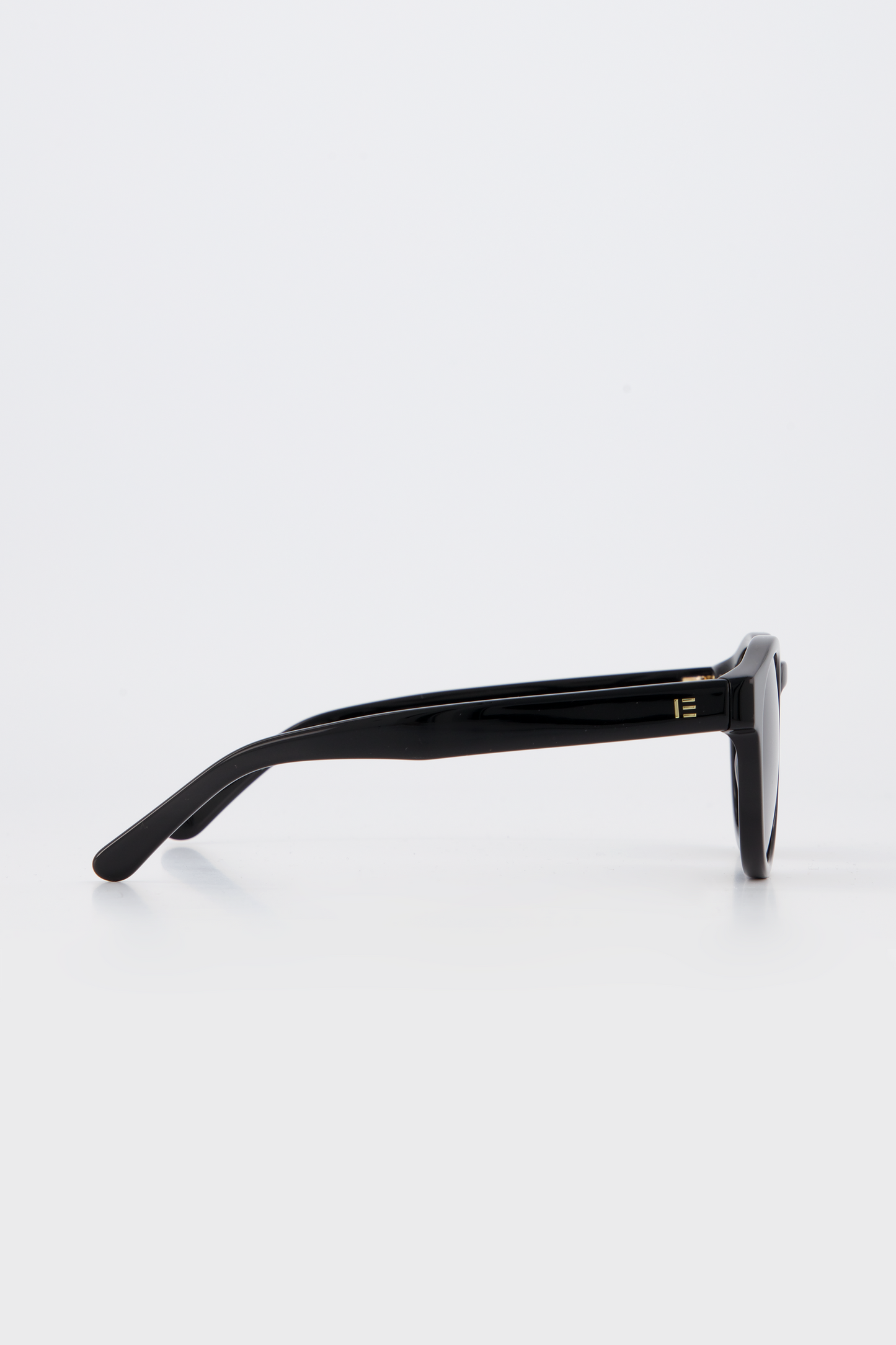 Isle of Eden Eddie black sunglasses, side profile view showing temple length and hinge detail