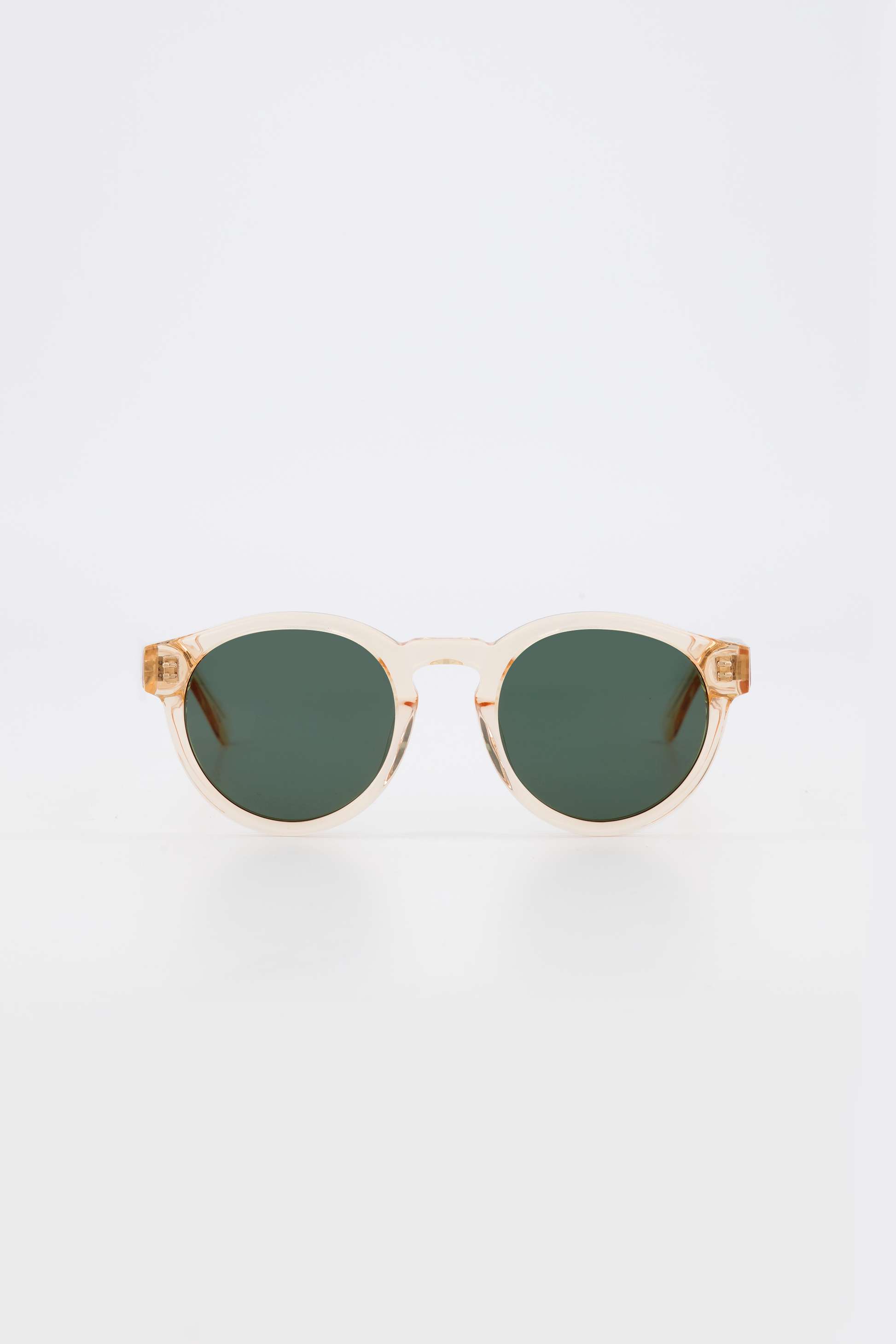 Isle of Eden Eddie champagne sunglasses, front view showing round frame and green lenses