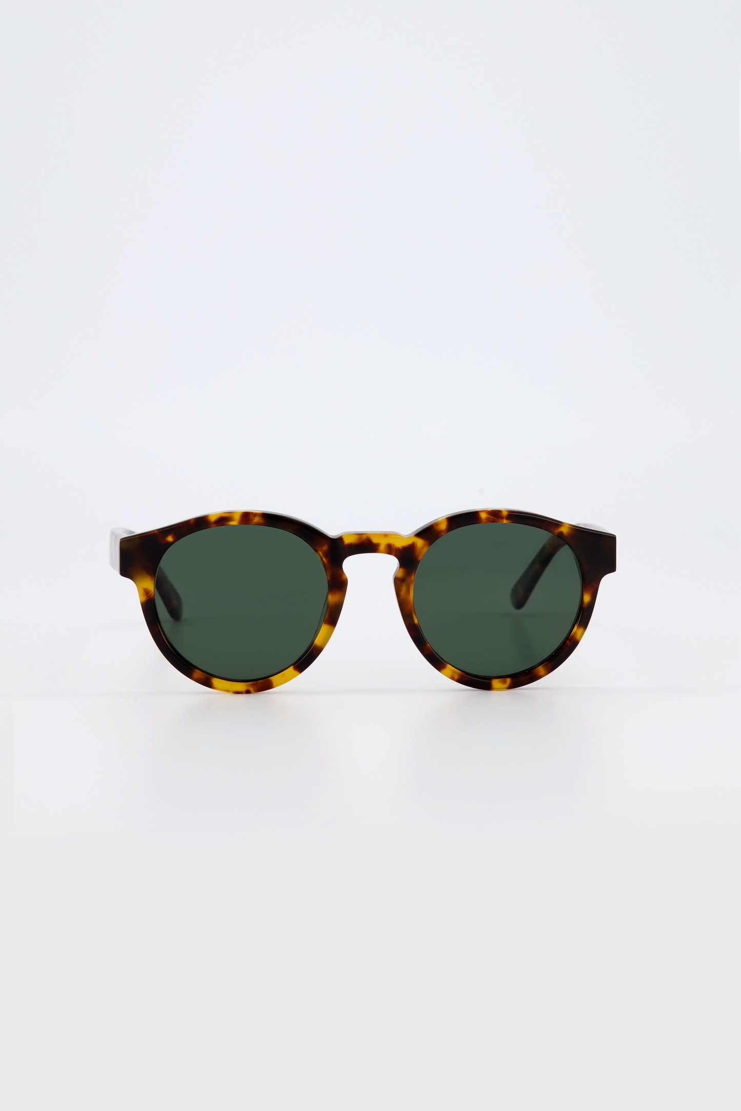 Isle of Eden Eddie tortoise sunglasses, front view showing round frame and green lenses
