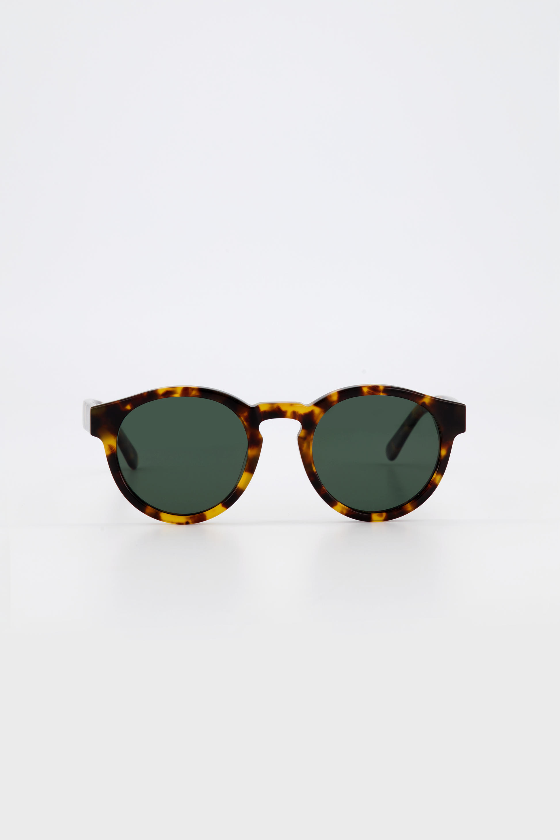Isle of Eden Eddie tortoise sunglasses, front view showing round frame and green lenses