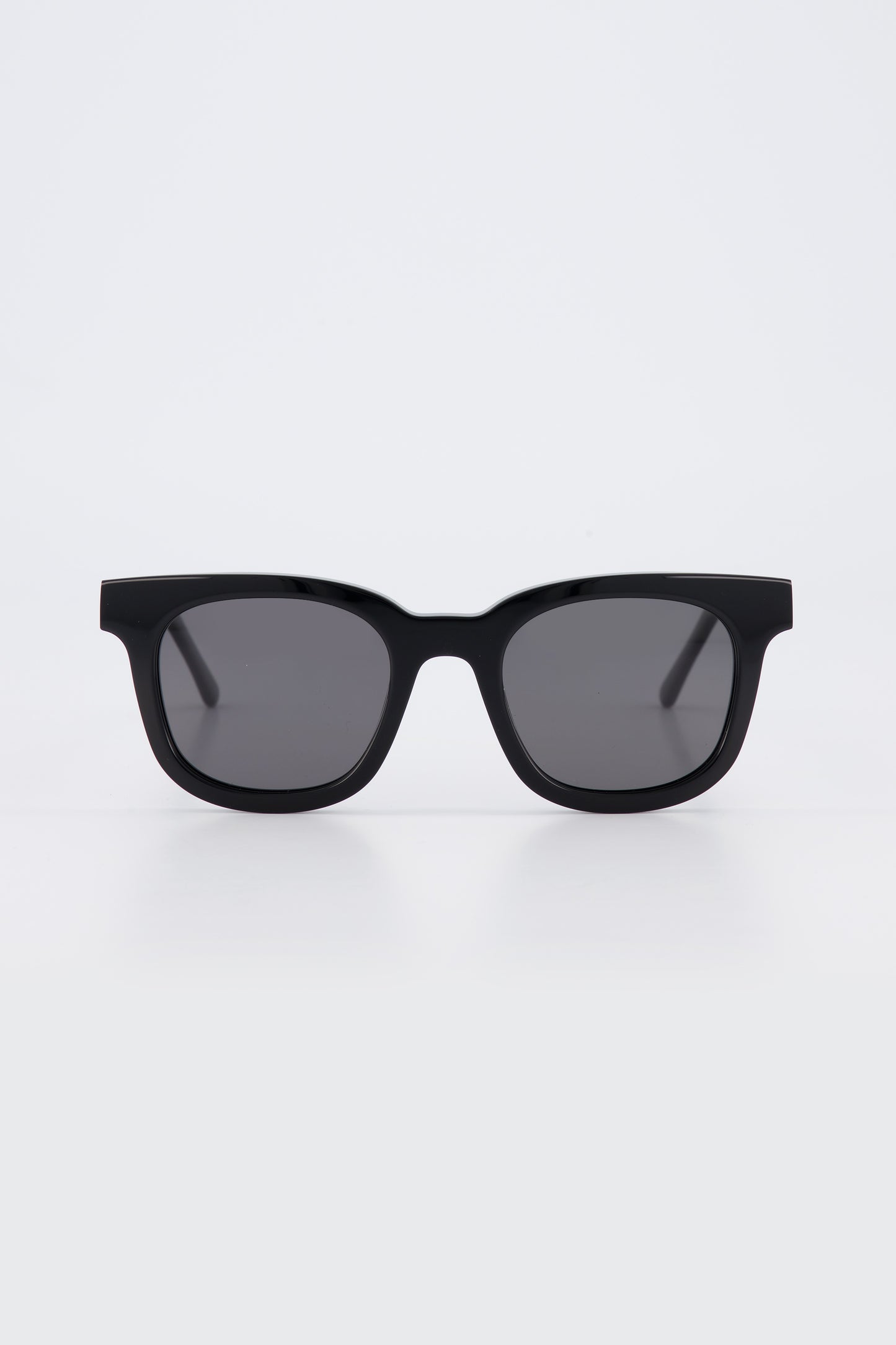 Isle of Eden Eugene black sunglasses, front view showing flat brow square frame and dark lenses