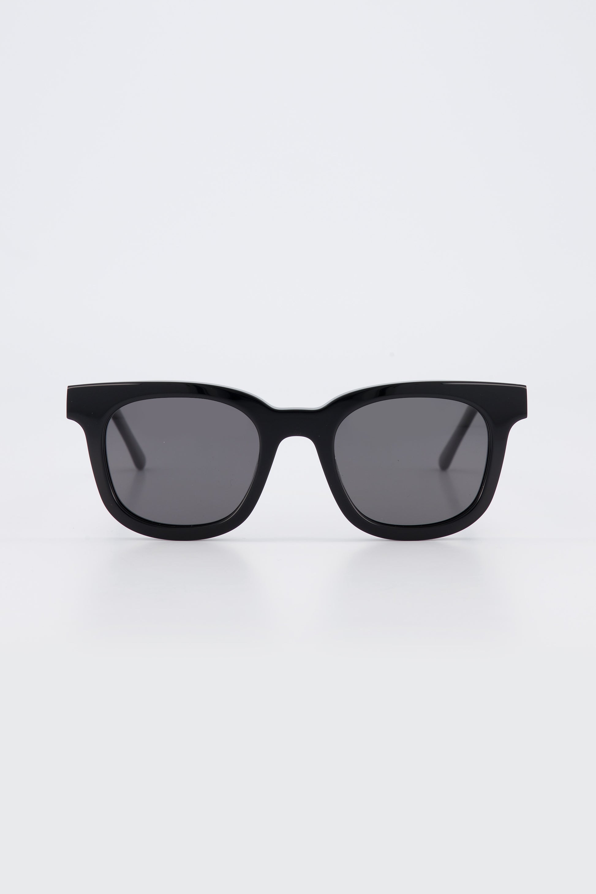 Isle of Eden Eugene black sunglasses, front view showing flat brow square frame and dark lenses