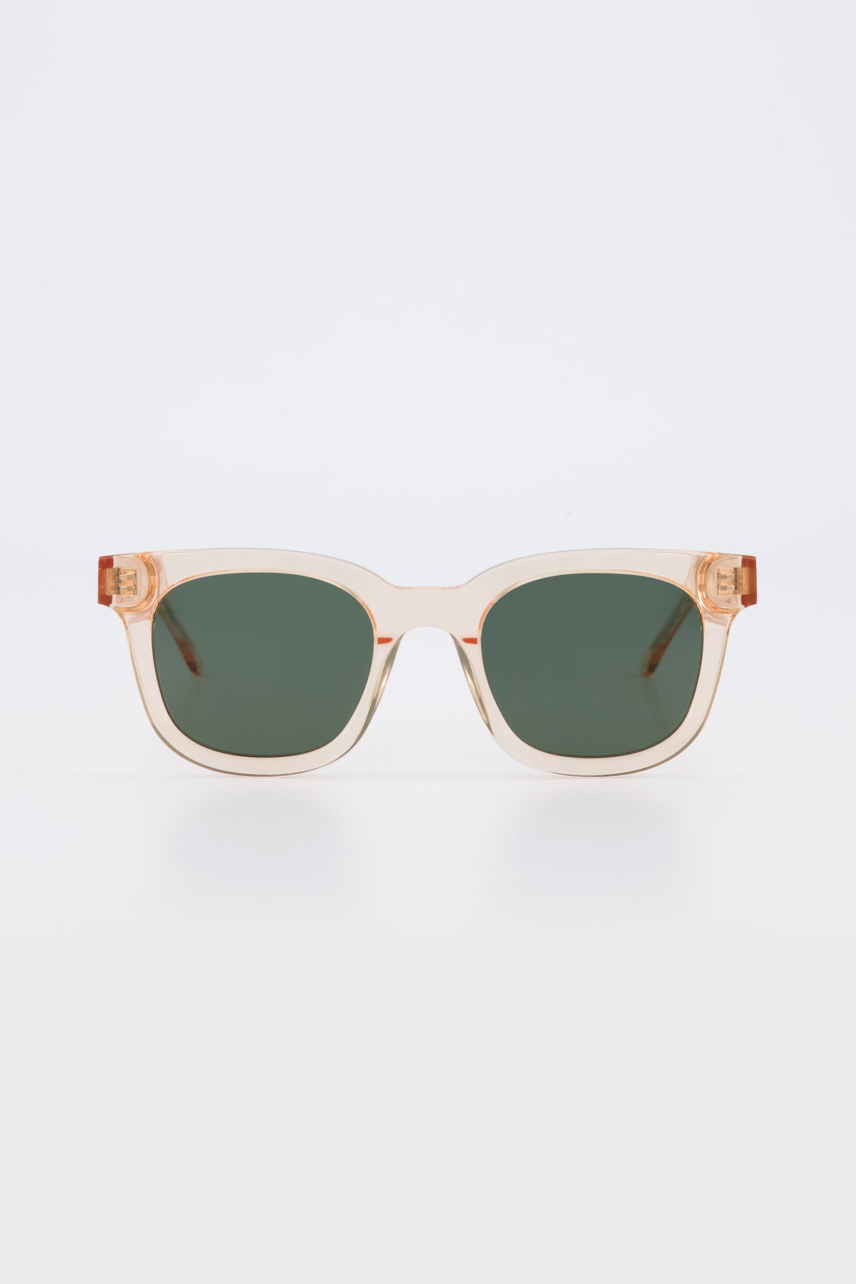 Isle of Eden Eugene champagne sunglasses, front view showing flat brow square frame and green lenses