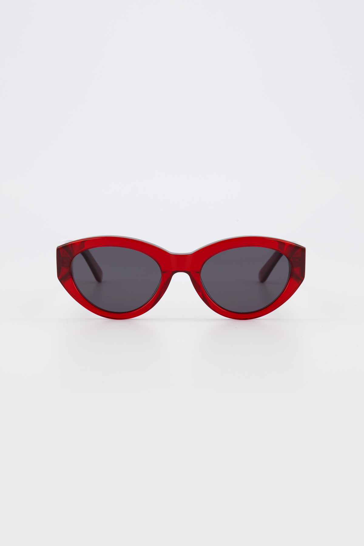 Isle of Eden Felina red sunglasses, front view showing cat-eye frame and dark lenses