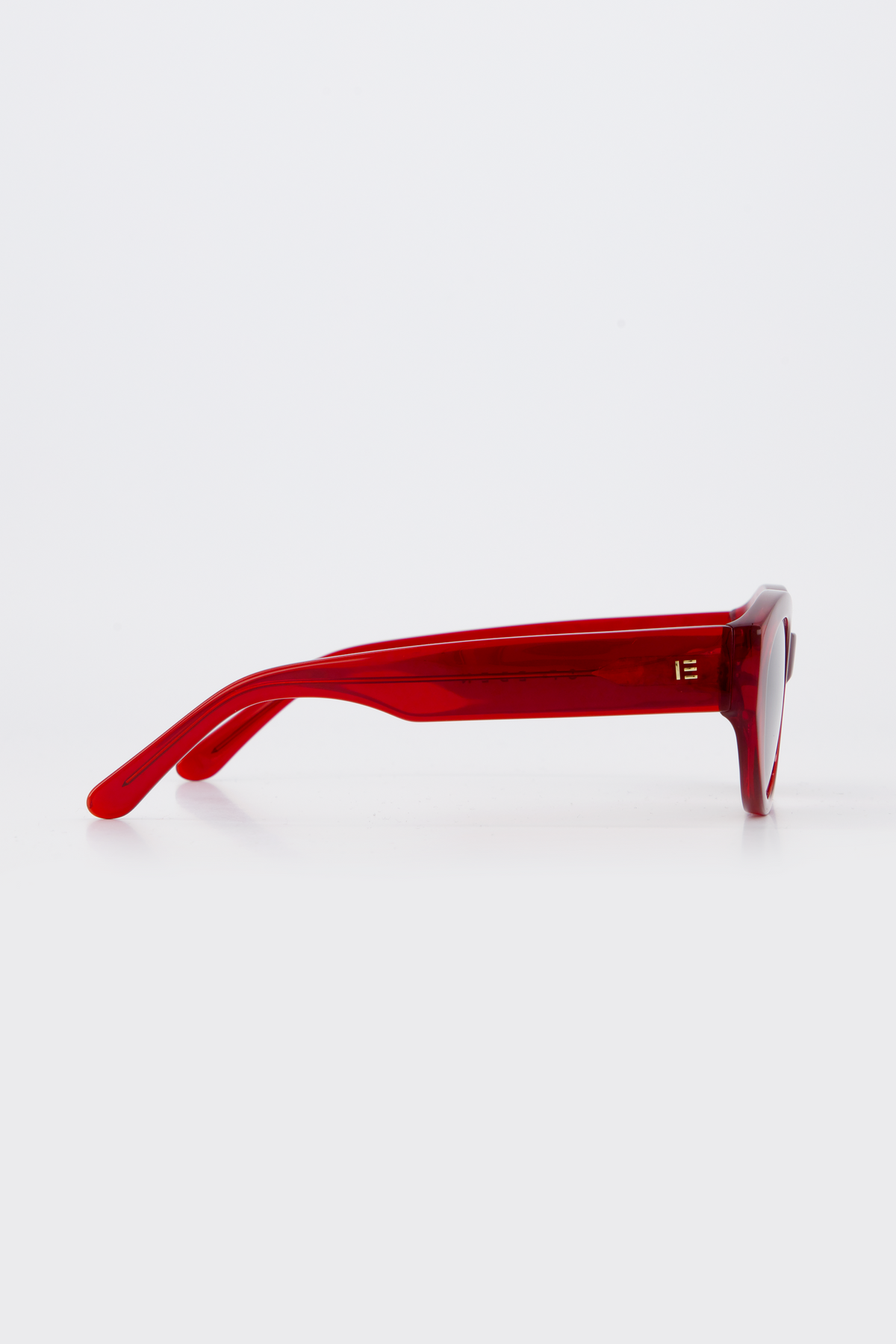 Isle of Eden Felina red sunglasses, side profile view showing temple length and hinge detail