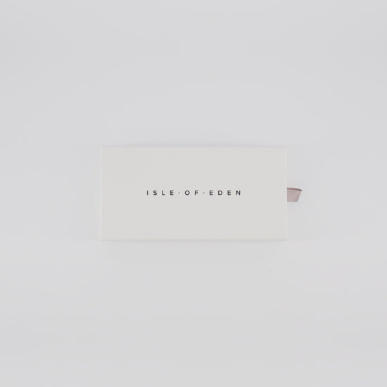 Isle of Eden Goldie sunglasses packaging video showing the branded box and case