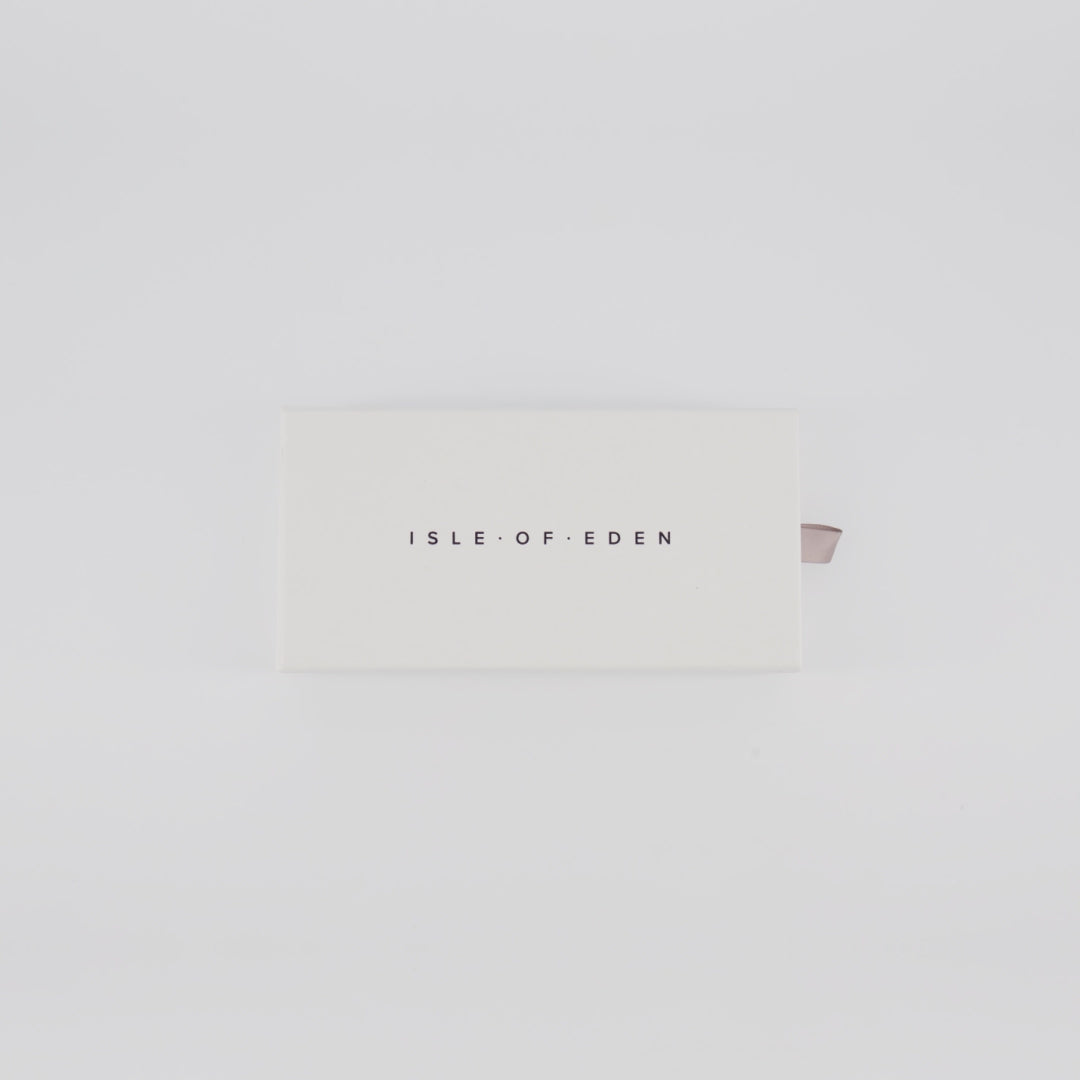 Isle of Eden Goldie sunglasses packaging video showing the branded box and case