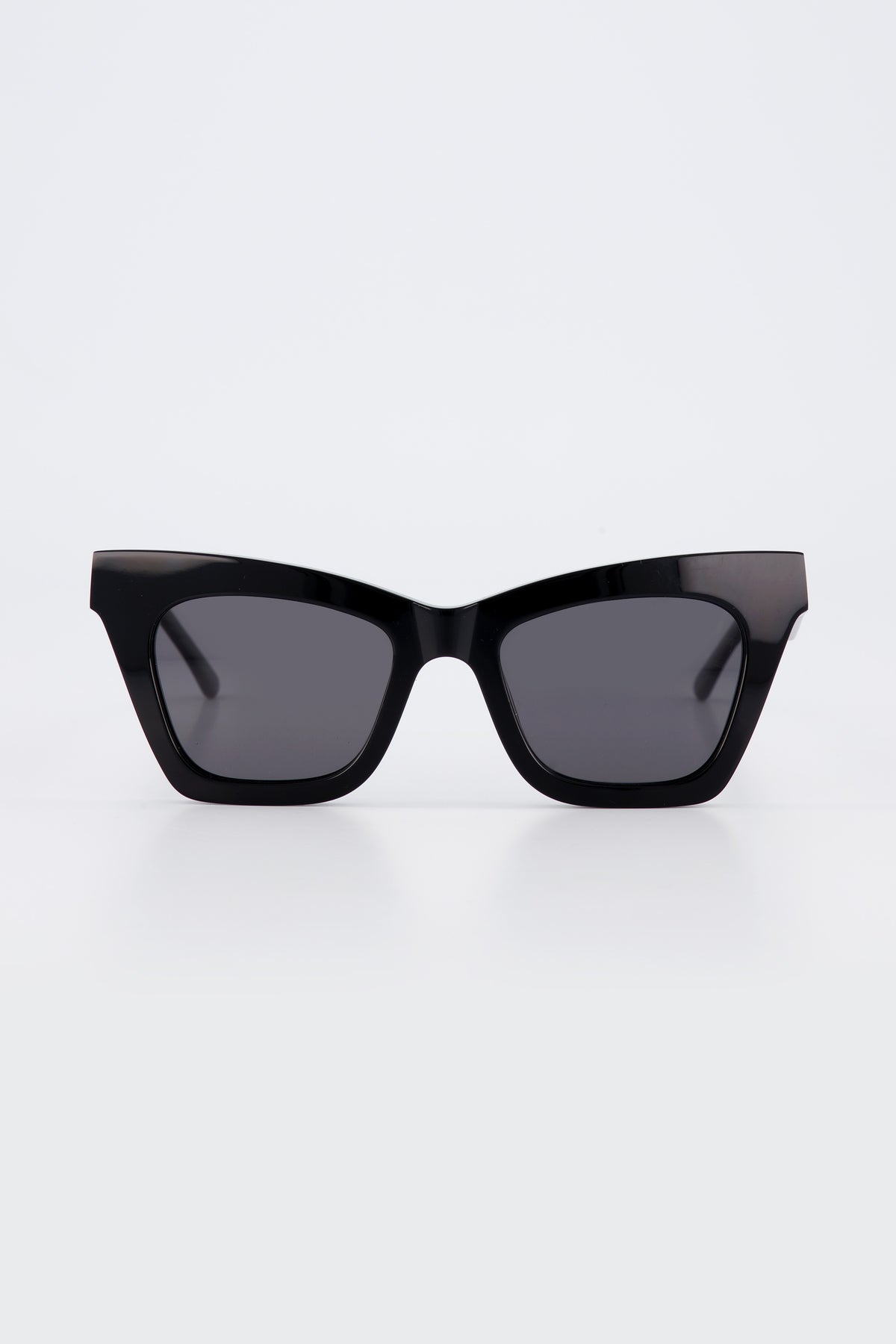 Isle of Eden Sienna black sunglasses, front view showing angular cat-eye frame and dark lenses