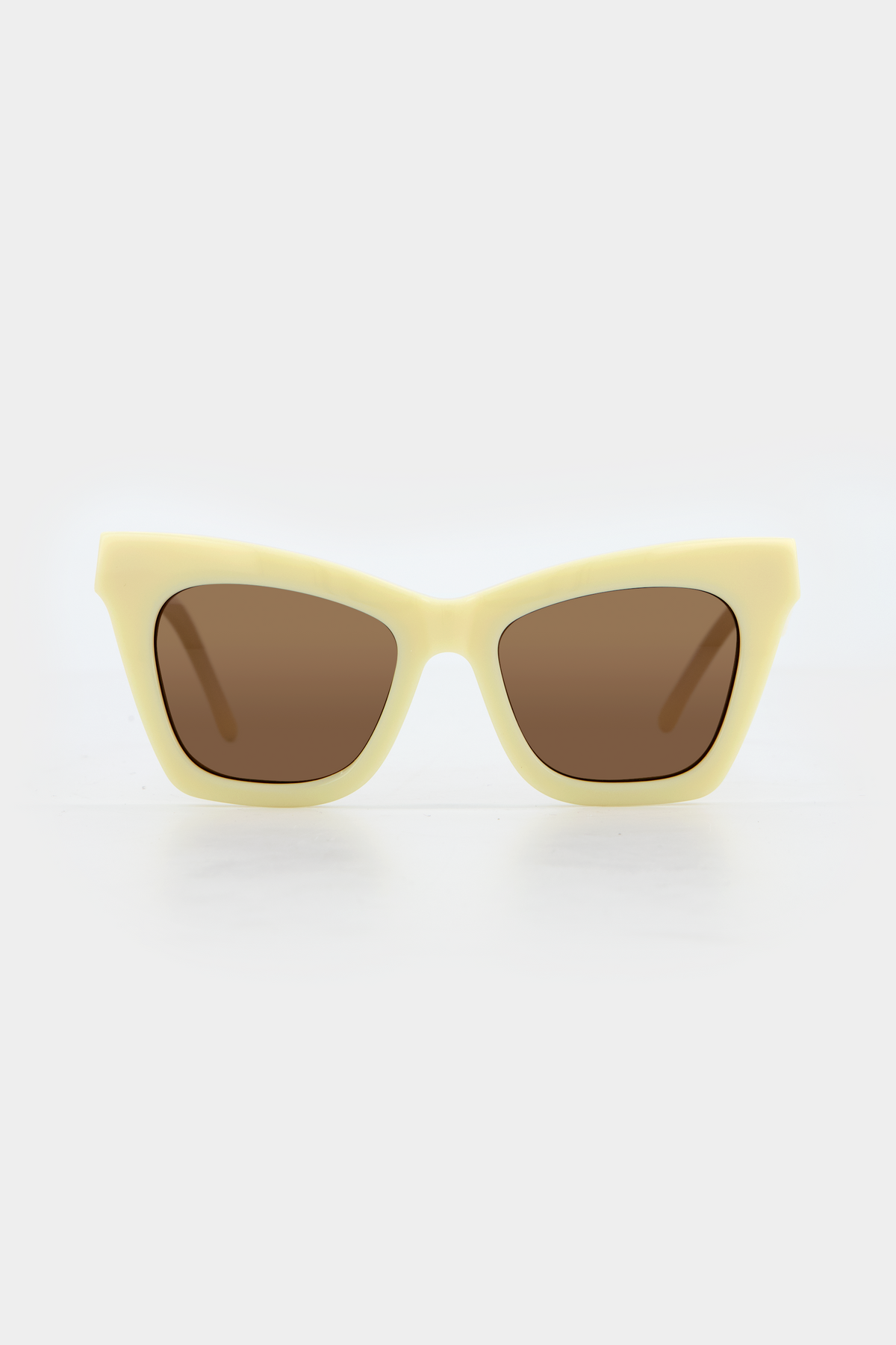 Isle of Eden Sienna ivory sunglasses, front view showing angular cat-eye frame and brown lenses