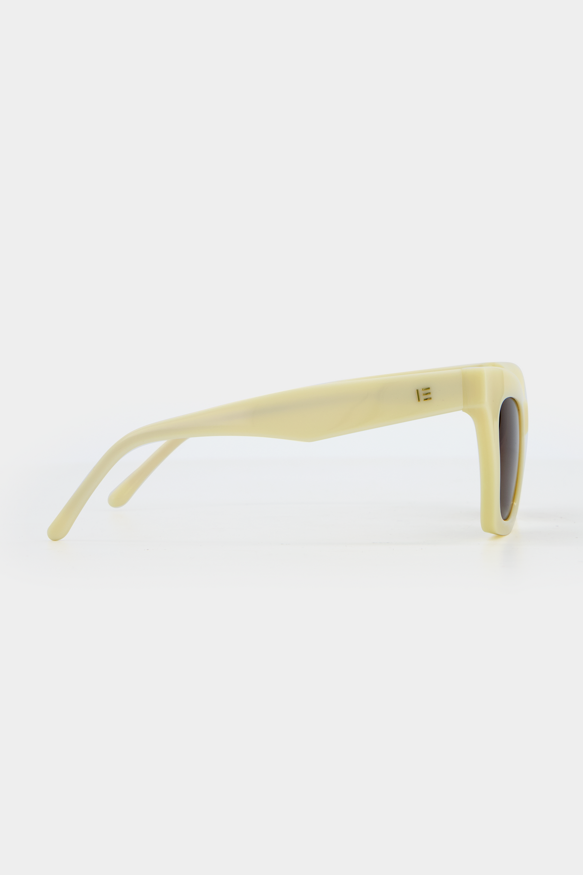 Isle of Eden Sienna ivory sunglasses, side profile view showing temple length and hinge detail