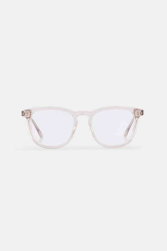 Isle of Eden Louis-Philippe sand prescription glasses, front view showing the clear bio-acetate frame with rose gold hinge accents, an eco-conscious eyewear choice for everyday vision correction