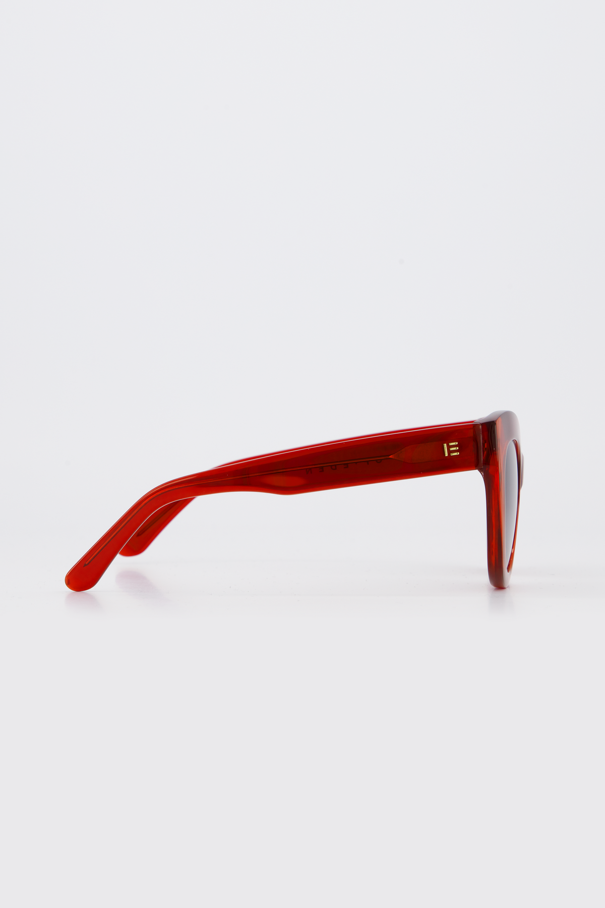 Isle of Eden Wynnie red sunglasses, side profile view showing temple length and hinge detail