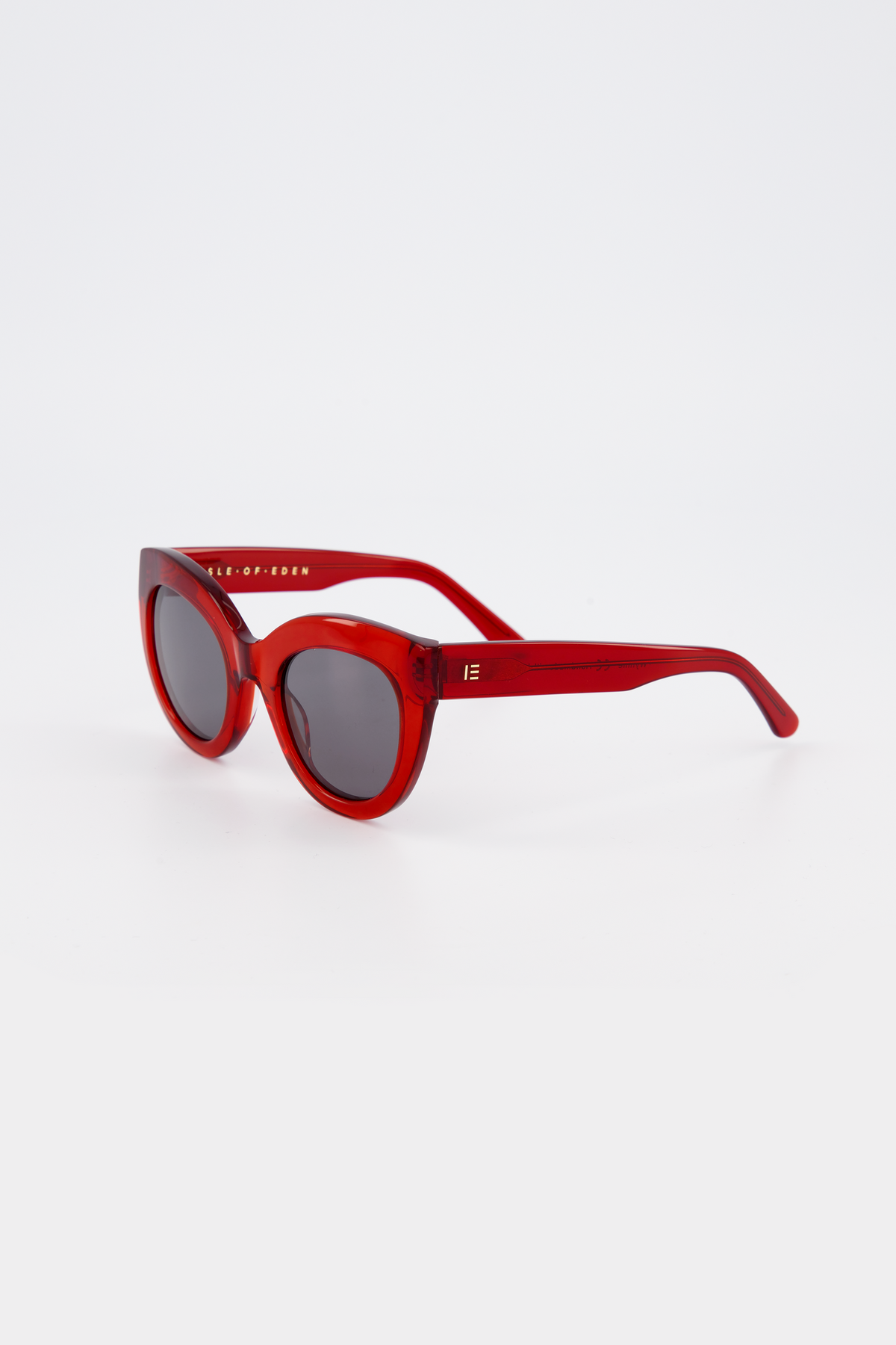 Isle of Eden Wynnie red sunglasses, three-quarter angle showing oversized cat-eye frame